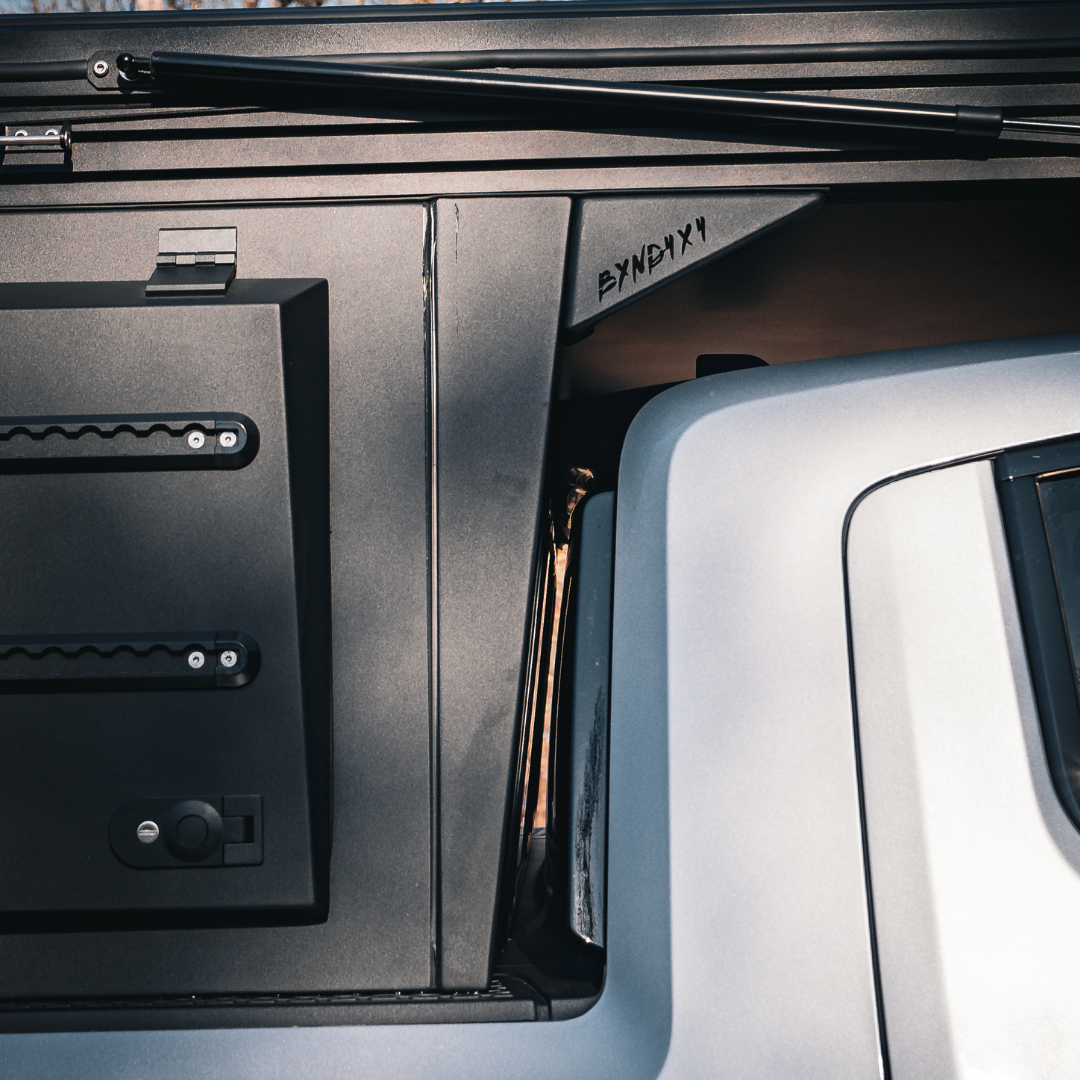 Rear view of Rivian R1T aluminum overland camper