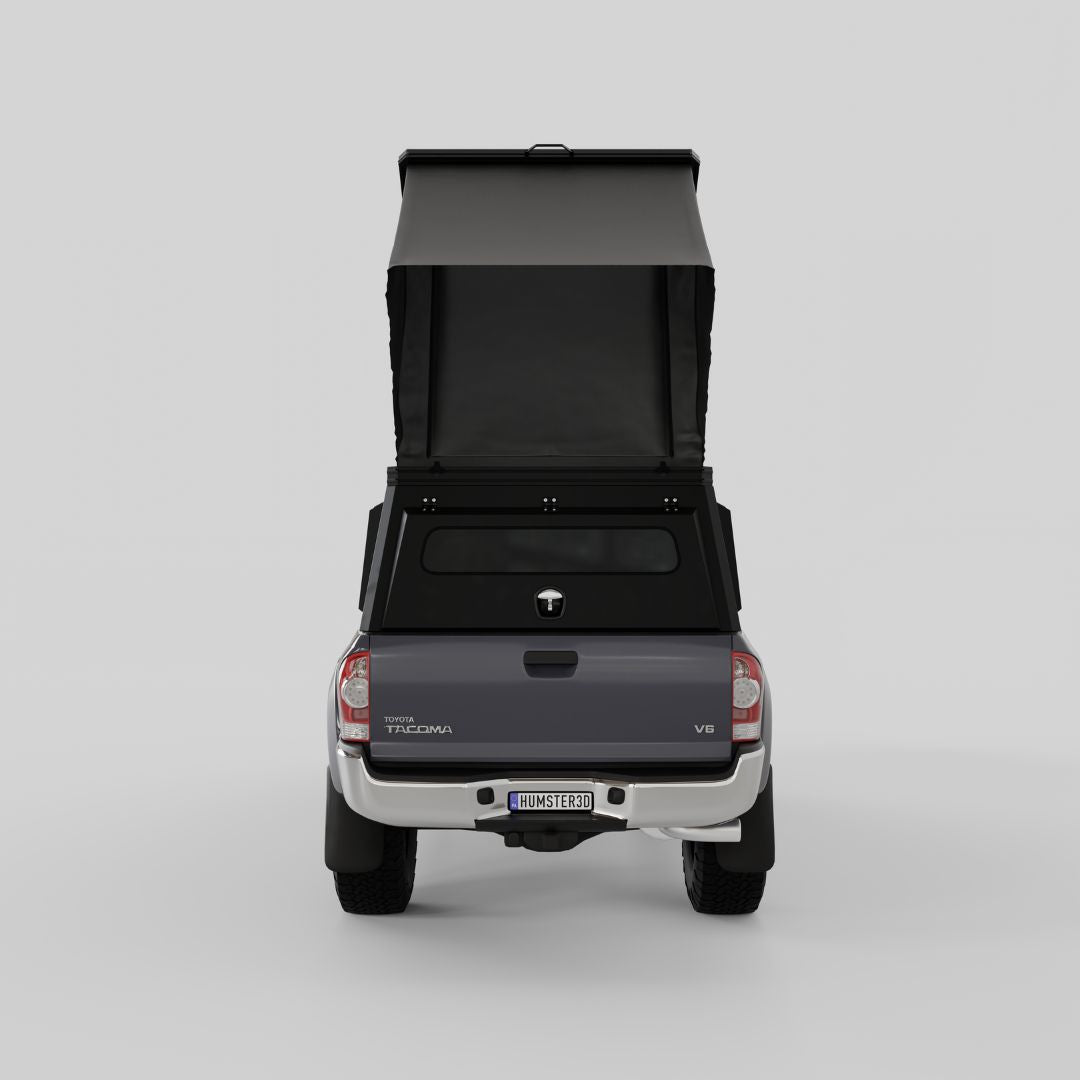 Rear view of Inca4x4 aluminum Tacoma camper with pop-up roof open