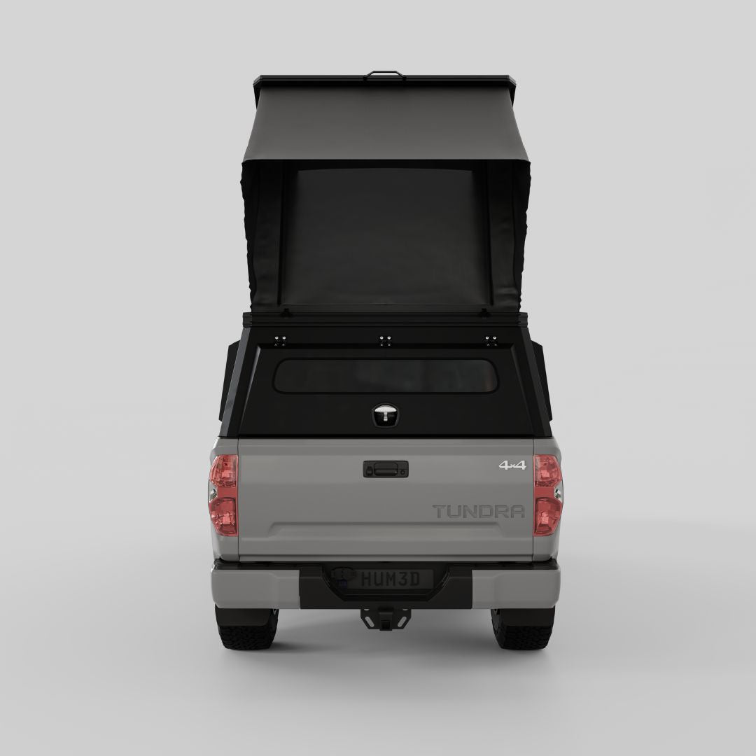 Front three-quarter view of Toyota Tundra with aluminum truck camper