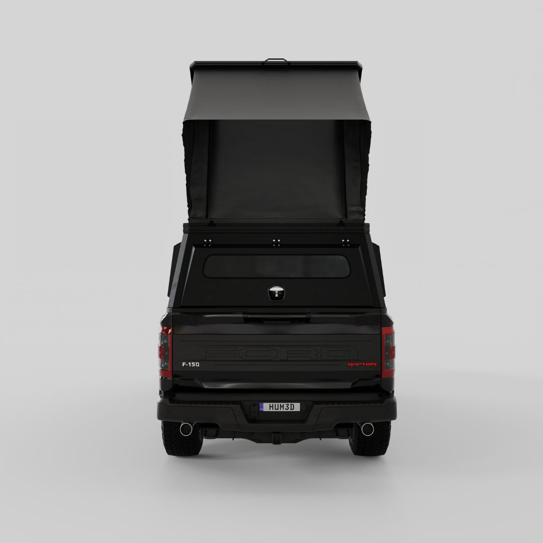 Rear three-quarter view of Inca4x4 aluminum camper on Ford full-size pickup