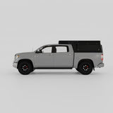 Toyota Tundra with Inca4x4 aluminum wedge camper in travel position