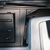 Rear view of Rivian R1T aluminum overland camper