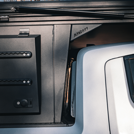 Rear view of Rivian R1T aluminum overland camper