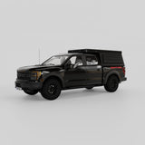 Front three-quarter view of Ford Raptor with aluminum rooftop camper