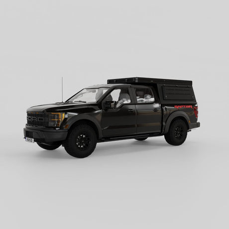 Front three-quarter view of Ford Raptor with aluminum rooftop camper