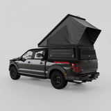 Ford F-150 with Inca4x4 wedge camper in travel position