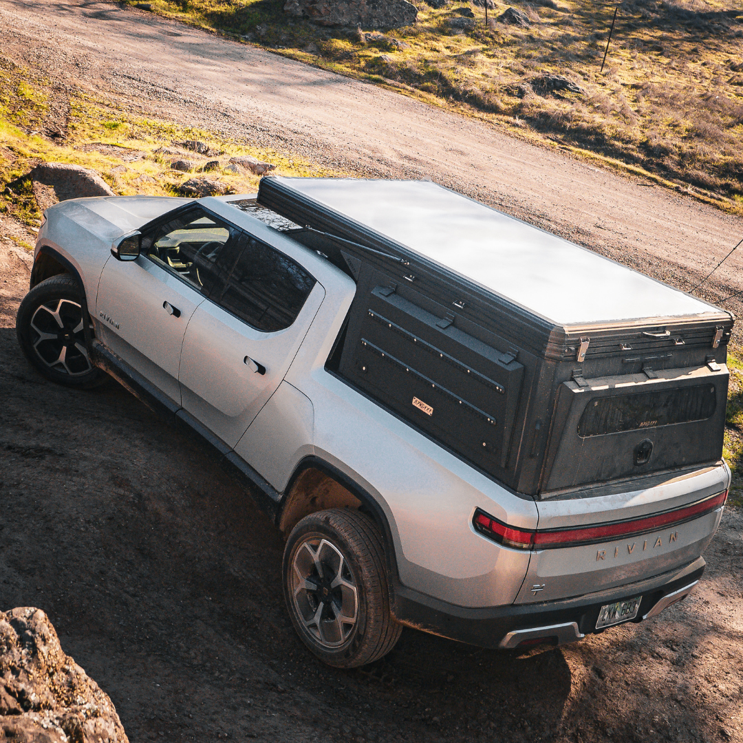 Low-profile aluminum truck camper for Rivian R1T electric truck