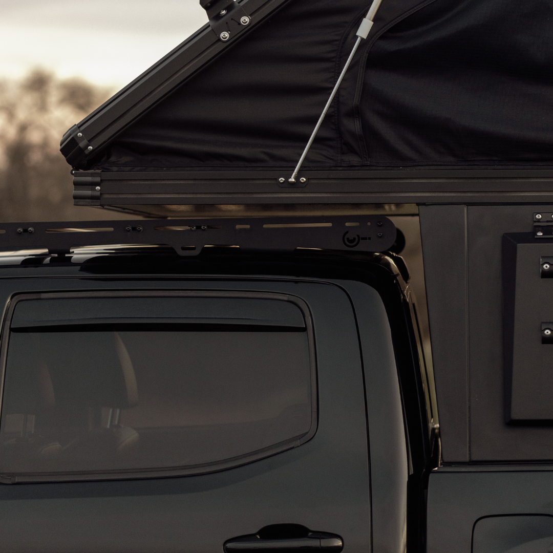 Low-profile Inca4x4 aluminum wedge camper mounted on Toyota Tacoma