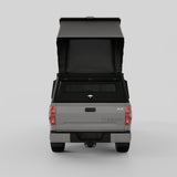 Front three-quarter view of Toyota Tundra with aluminum truck camper