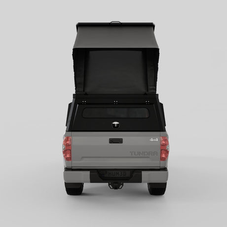 Front three-quarter view of Toyota Tundra with aluminum truck camper