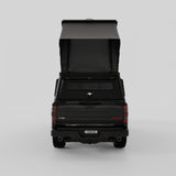 Rear three-quarter view of Inca4x4 aluminum camper on Ford full-size pickup