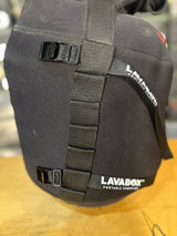 Black portable camping stove with straps on a wooden surface, featuring the Lavabox brand.
