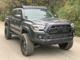 Front passengers side view of gray Toyota Tacoma with Premium roof rack - Cali Raised LED