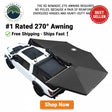 Black XD Nomadic 270 awning on a white truck with product features highlighted.