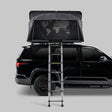 iKamper Skycamp 4.0 Quad hard shell rooftop tent open on black SUV